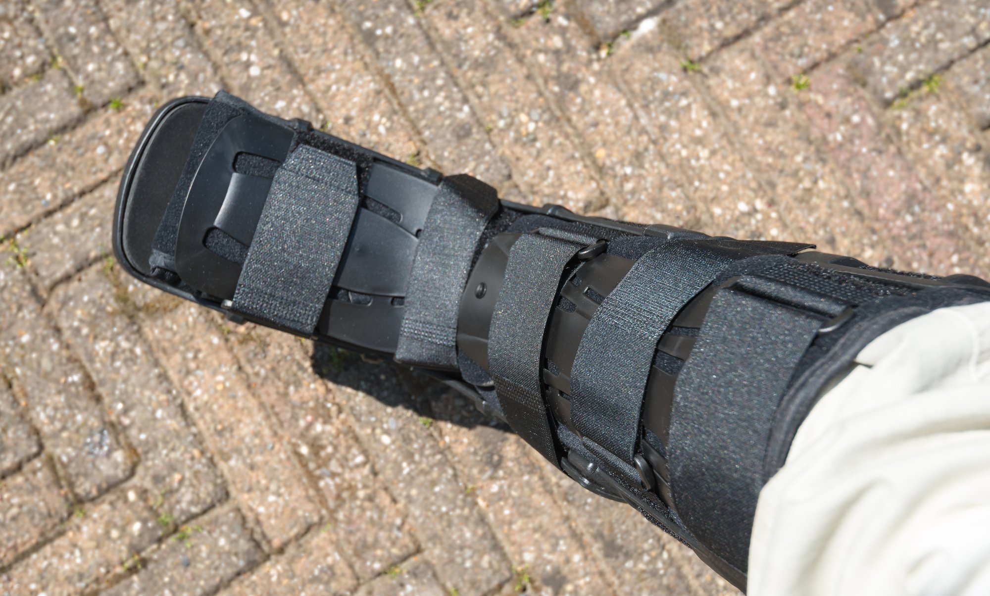 Orthopedic walking boot worn by a patient using durable medical equipment for recovery. Orthopedic walking boot worn by a patient using durable medical equipment for recovery.