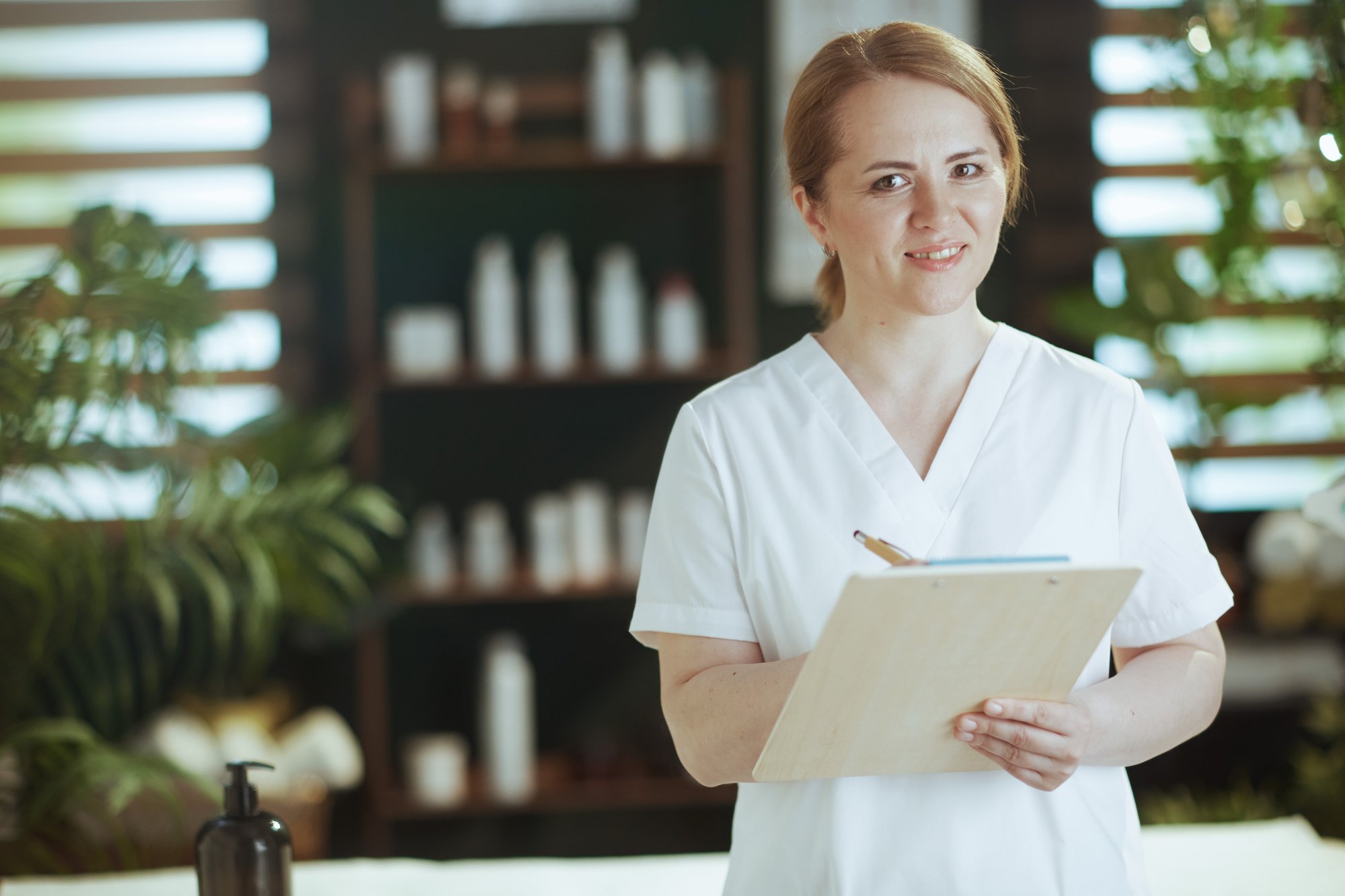Healthcare professional reviewing practice operations and administrative records in a medical office. Healthcare professional reviewing practice operations and administrative records in a medical office.