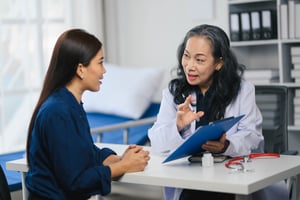 doctor giving performance review to staff member