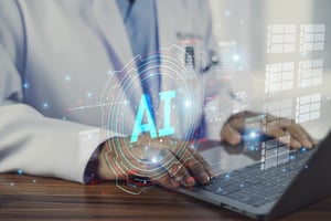 doctor at a laptop typing